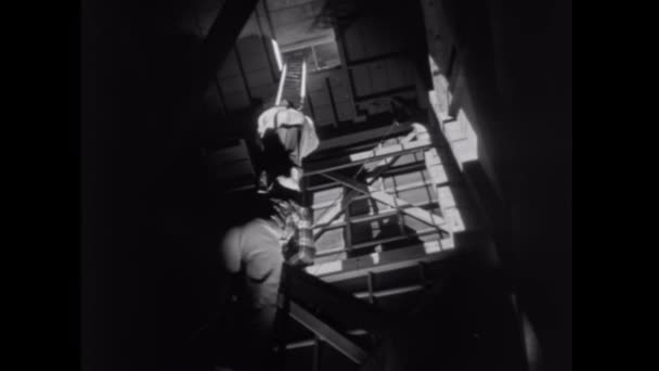 Two Men Climbing Shaky Ladder — Stock Video