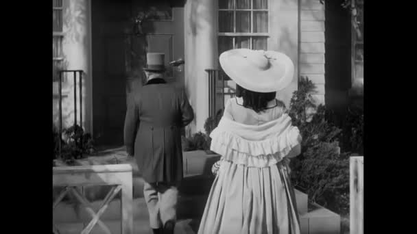 Rear View Couple Dressed 18Th Century Clothing Entering House 1940S — Stock Video
