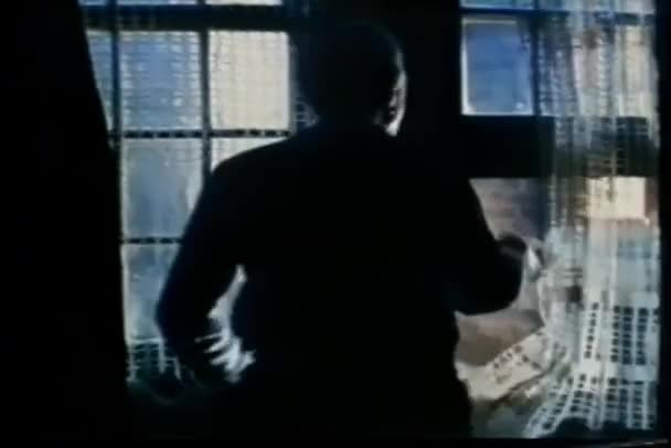 Man Dark Room Looking Out Window — Stock Video