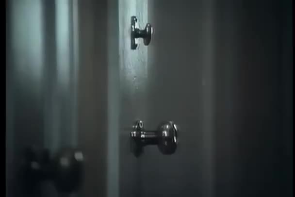 Close Doorknob Turning Itself — Stock Video
