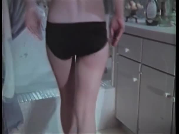 Rear View Woman Removing Panties Going Bathtub 1970S — Stock Video