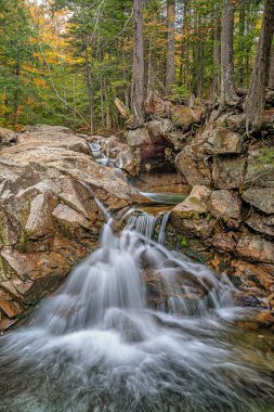 Waterfall in Autumn on the swift river near incoln, NH