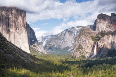 Tunnel View, a famous viewpoint of Yosemite Valley with El Capitan and Bridalveil Falls. Yosemite National Park, California, USA clipart