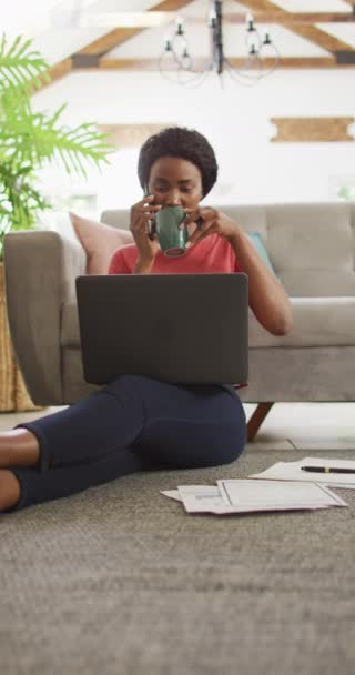 Vertical Video African American Woman Sitting Floor Using Laptop Home — Stock Video