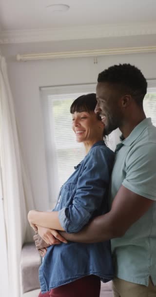 Vertical Video Happy Diverse Couple Embracing Home Family Spending Time — Stock Video