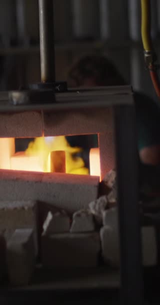 Vertical Video Caucasian Male Blacksmith Forging Heating Hot Metal Kiln — Stock Video