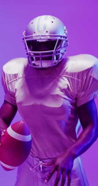 Vertical Video African American Male American Football Player Neon Purple — Stock Video