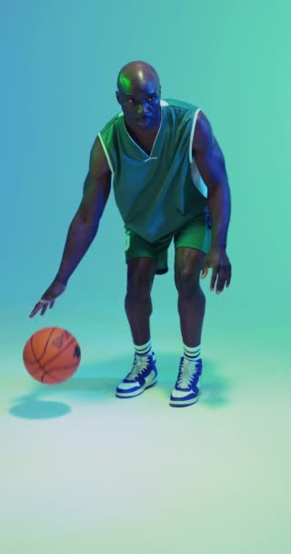 Vertical Video African American Male Basketball Player Bouncing Ball Green — Stock Video