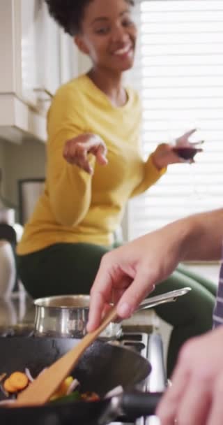 Vertical Video Happy Diverse Couple Preparing Meal Kitchen Talking Love — Stock Video