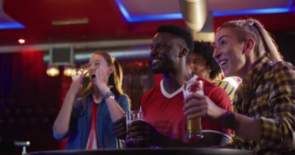 Video Diverse Group Happy Friends Drinking Watching Sports Game Bar — Stock Video