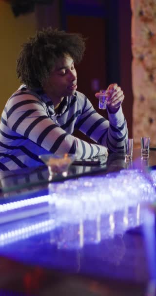 Vertical Video Drunk African American Man Sitting Bar Drinking Shots — Vídeo de Stock