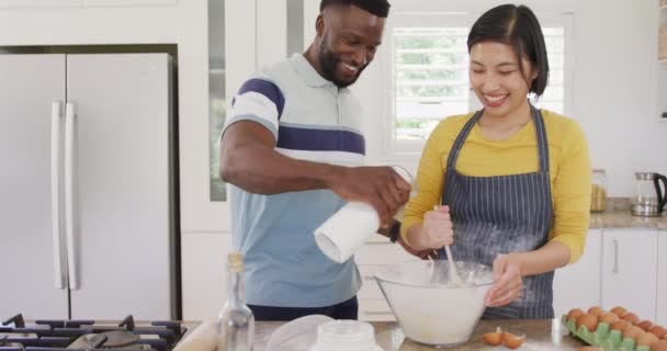 Happy Diverse Couple Wearing Apron Baking Kitchen Spending Quality Time — Video