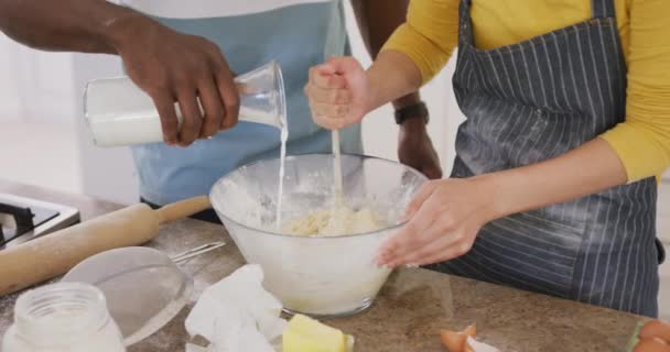 Mid Section Diverse Couple Wearing Aprons Baking Kitchen Spending Quality — Videoclip de stoc