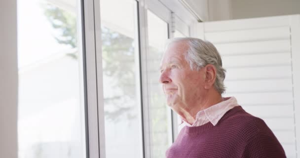 Happy Caucasian Senior Man Smiling Looking Window Alone Active Retirement — Vídeo de Stock