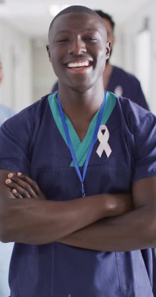 Vertical Video Portrait Happy African American Male Doctor Cancer Ribbon — Stockvideo
