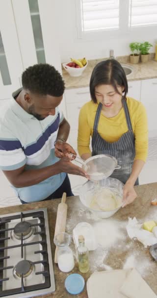Vertical Video Happy Diverse Couple Baking Kitchen Spending Quality Time — Vídeos de Stock