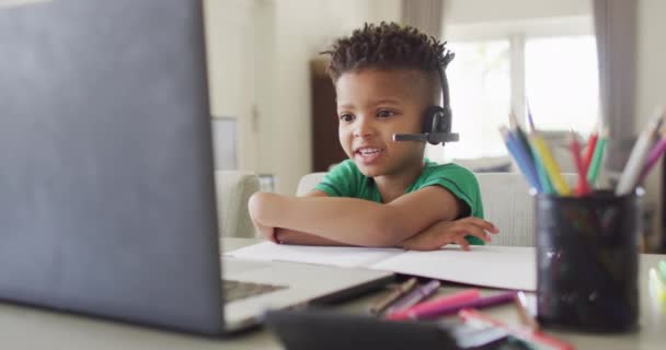 African American Boy Wearing Headphones Having School Video Call Laptop — Vídeo de stock
