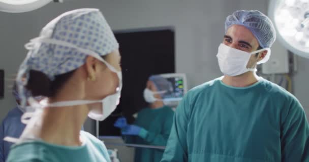 Video Asian Female Surgeon Face Mask Diverse Colleague Talking Smiling — Video
