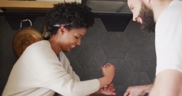 Video Happy Diverse Couple Talking Cooking Breakfast Kitchen Copy Space — Vídeo de stock