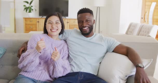 Portrait Happy Diverse Couple Embracing Living Room Spending Quality Time — Stockvideo