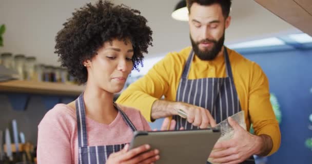 Video Happy Diverse Couple Aprons Using Tablet Baking Kitchen Home — Stok video