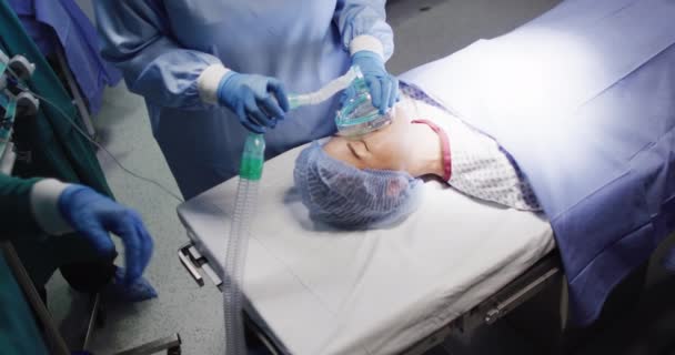 Video Midsection Surgical Assistant Giving Gas Asian Female Patient Operating — Video