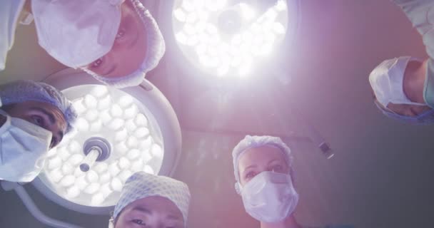 Video Patient View Looking Diverse Group Surgeons Lights Operating Theatre — Vídeo de Stock