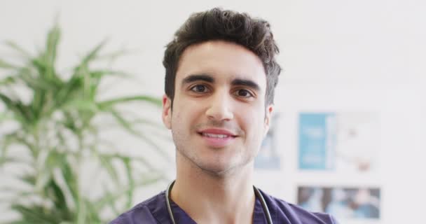 Video Portrait Happy Biracial Male Doctor Smiling Hospital Corridor Copy — Stok video