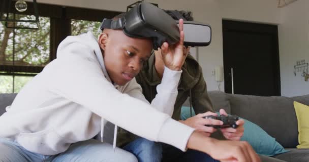 Happy Diverse Male Teenage Friends Playing Video Games Using Headsets — Vídeo de Stock