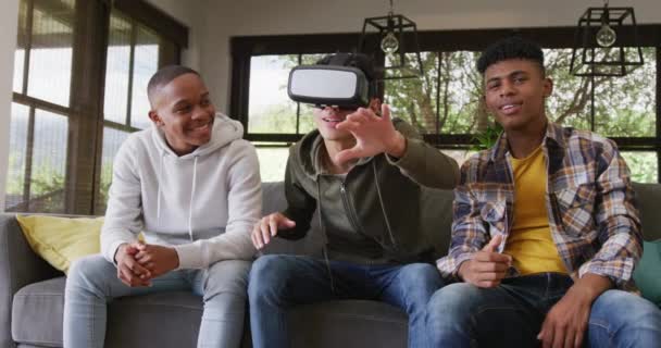 Happy Diverse Male Teenage Friends Playing Video Games Using Headset — Video Stock