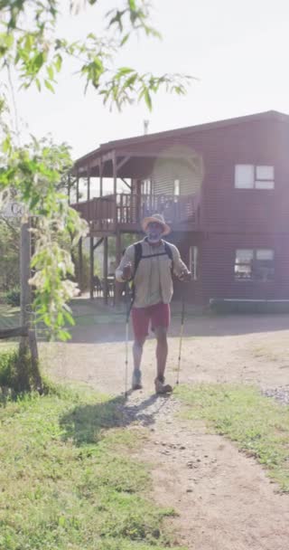 Vertical Video Senior African American Man Hiking Trekking Poles Hiking — Stock video