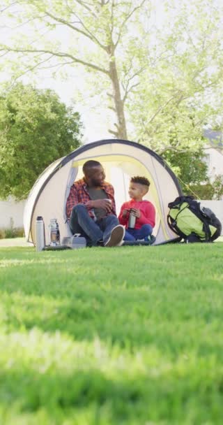 Vertical Video African American Man His Son Sitting Tent Garden — Video Stock