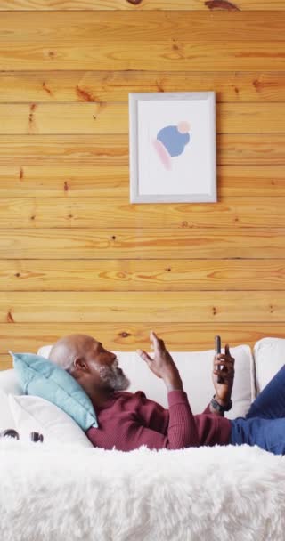 Vertical Video Senior African American Man Spending Time Log Cabin — Αρχείο Βίντεο