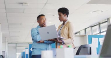 African american business people using laptop at office, slow motion. Working at office, business concept.