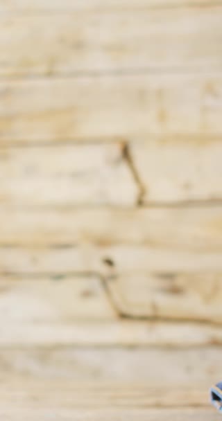 Vertical Video Folded Jeans Different Shades Wooden Background Copy Space — Wideo stockowe