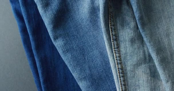 紧贴的牛仔裤与不同的色调与复制空间 牛仔日 风格和设计理念 — 图库视频影像