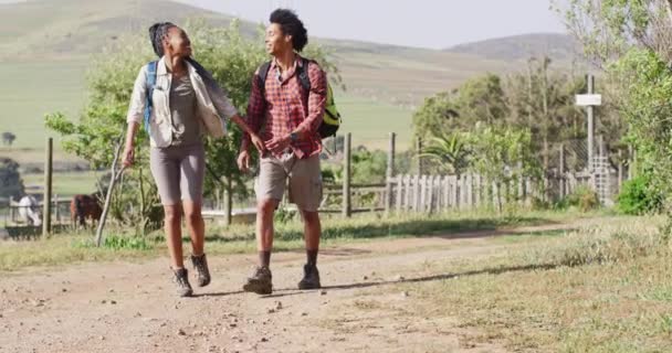 Happy African American Couple Backpacks Hiking Together Sunny Day Slow — Wideo stockowe