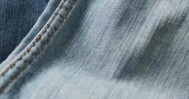 Farklı tonlarda kot pantolon ve fotokopi alanı. Denim günü, malzeme, tarz ve tasarım konsepti.