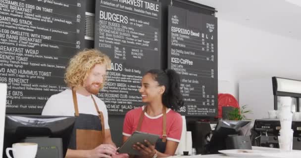 Happy Diverse Male Female Baristas Talking Using Tablet Counter Cafe — Stock Video
