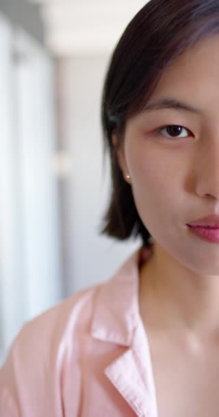 Vertical Video Half Face Portrait Asian Woman Blinking Smiling Copy — Video