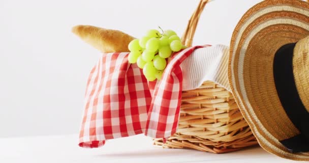 Picnic Basket Checkered Blanket Grapes Baguette Hat White Background Copy — Vídeo de stock