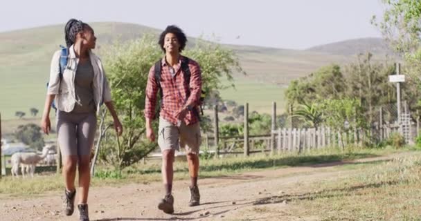 Happy African American Couple Backpacks Hiking Together Sunny Day Slow — Wideo stockowe