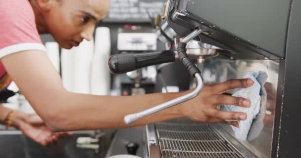 Happy Biracial Female Barista Weearing Apron Cleaning Coffee Machine Cafe — Wideo stockowe