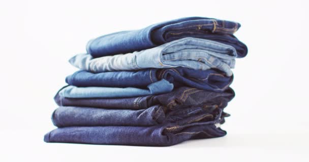 Close Folded Jeans Different Shades White Background Copy Space Denim — Wideo stockowe