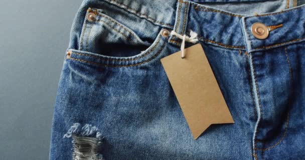 Close Jeans Tag Grey Background Copy Space Denim Day Material — Wideo stockowe