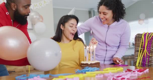 Video Woman Blowing Out Candles Birthday Cake Celebrating Diverse Friends — Stockvideo