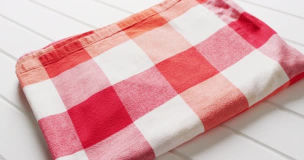 Close Folded Red White Checkered Blanket White Background Copy Space — 图库视频影像