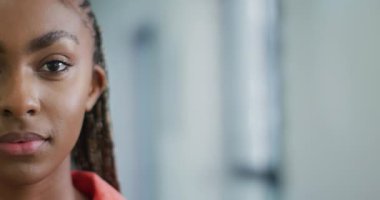 Happy african american woman smiling at camera. Lifestyle, living, spending free time at home concept.