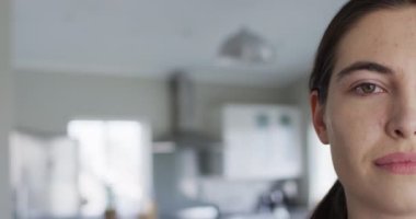 Portrait of happy caucasian woman looking at camera at home. Spending quality time at home concept.