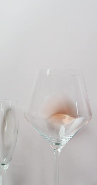 Vertical Video Diverse Wine Glasses White Surface Wine Alcohol Beverage — Vídeos de Stock